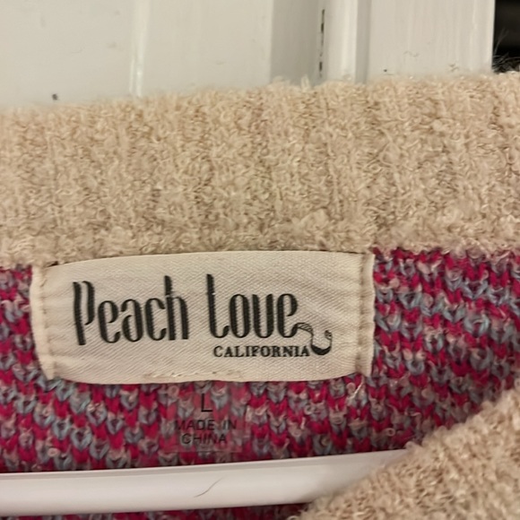 this sweater is from vernon, cali from a shop named “peach love california”. - Picture 2 of 3